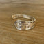 FUCKITY FUCK FUCK hand-stamped spoon cuff bracelet with modern font front view - 1936 W.A. Rogers Meadowbrook - upcycled vintage silverware - Laughing Frog Studio