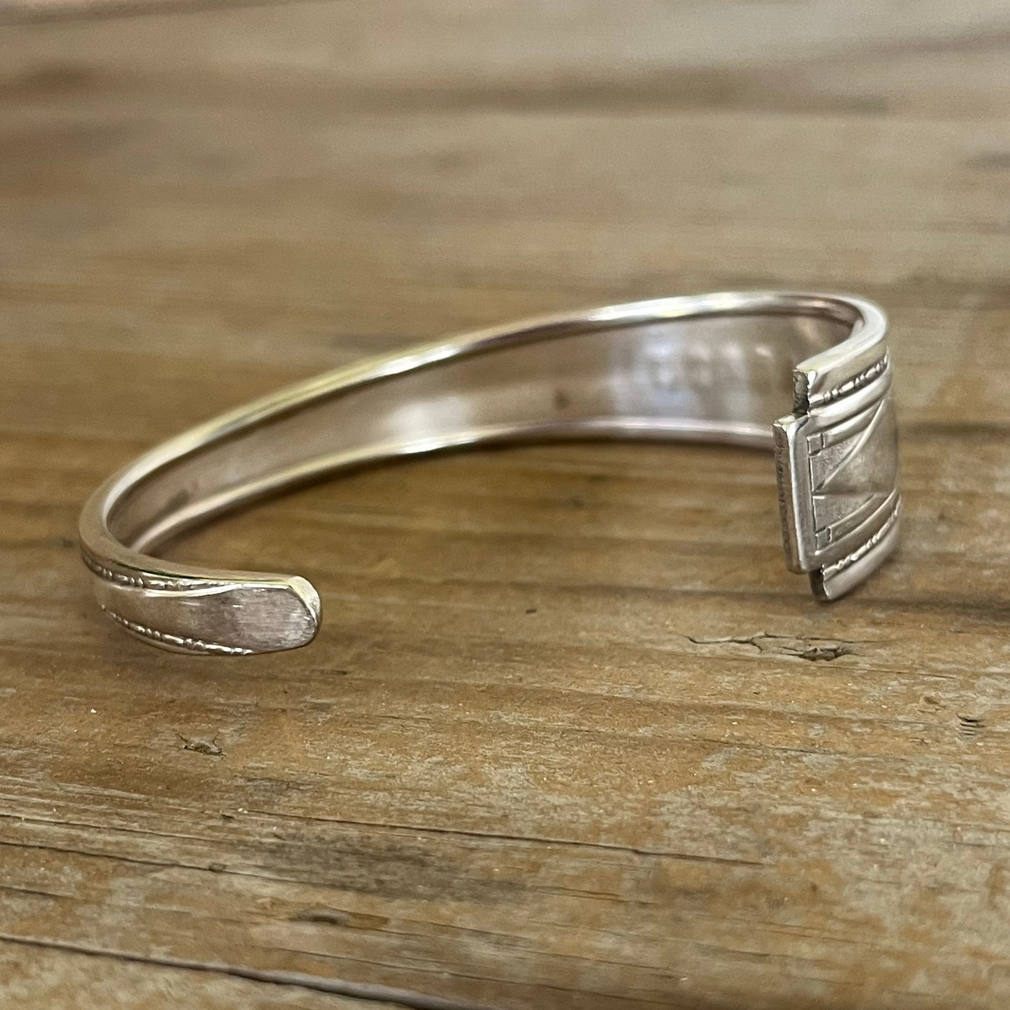 Inside view of BADASS hand-stamped spoon cuff bracelet - handcrafted from upcycled vintage silverware - Laughing Frog Studio