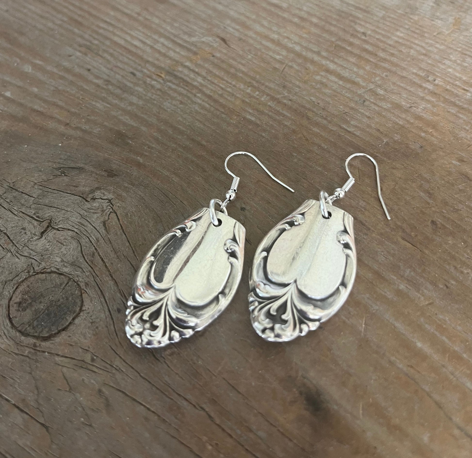 Close-up detail of Silver Fashion pattern spoon handle 2.25" drop earrings - spoon earrings - handcrafted from upcycled vintage silverware - Laughing Frog Studio