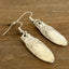 Close-up of FIRST LOVE pattern spoon handle drop earrings - spoon earrings - handcrafted from upcycled vintage silverware - Laughing Frog Studio