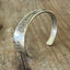 Top view detail of Devonshire/Mary Lou BADASS hand-stamped spoon cuff bracelet - upcycled vintage silverware - Laughing Frog Studio
