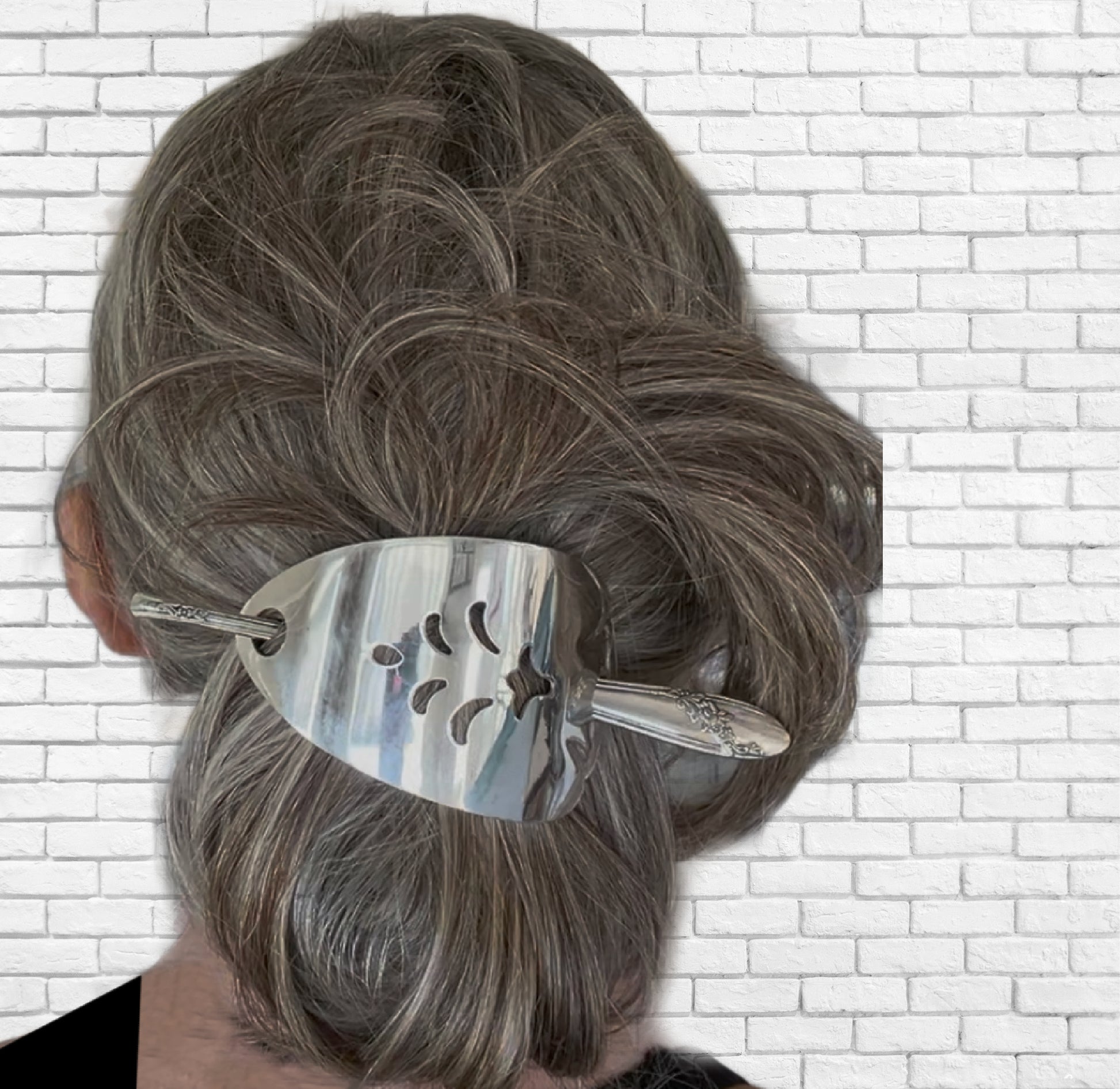 Oneida cake server hair barrette worn in hair showing functional use and size