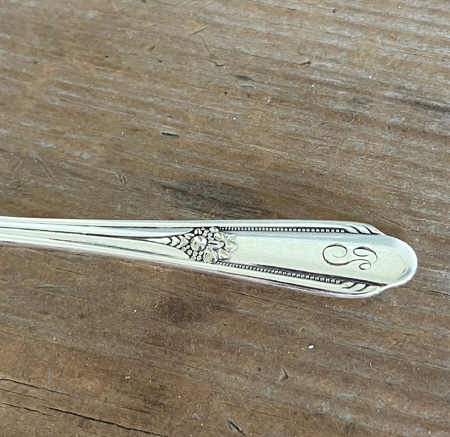 William Rogers Memory/Hiawatha spreader - hand-stamped "Who Cut the Cheese?" - close up of handle - upcycled vintage silverware - Laughing Frog Studio