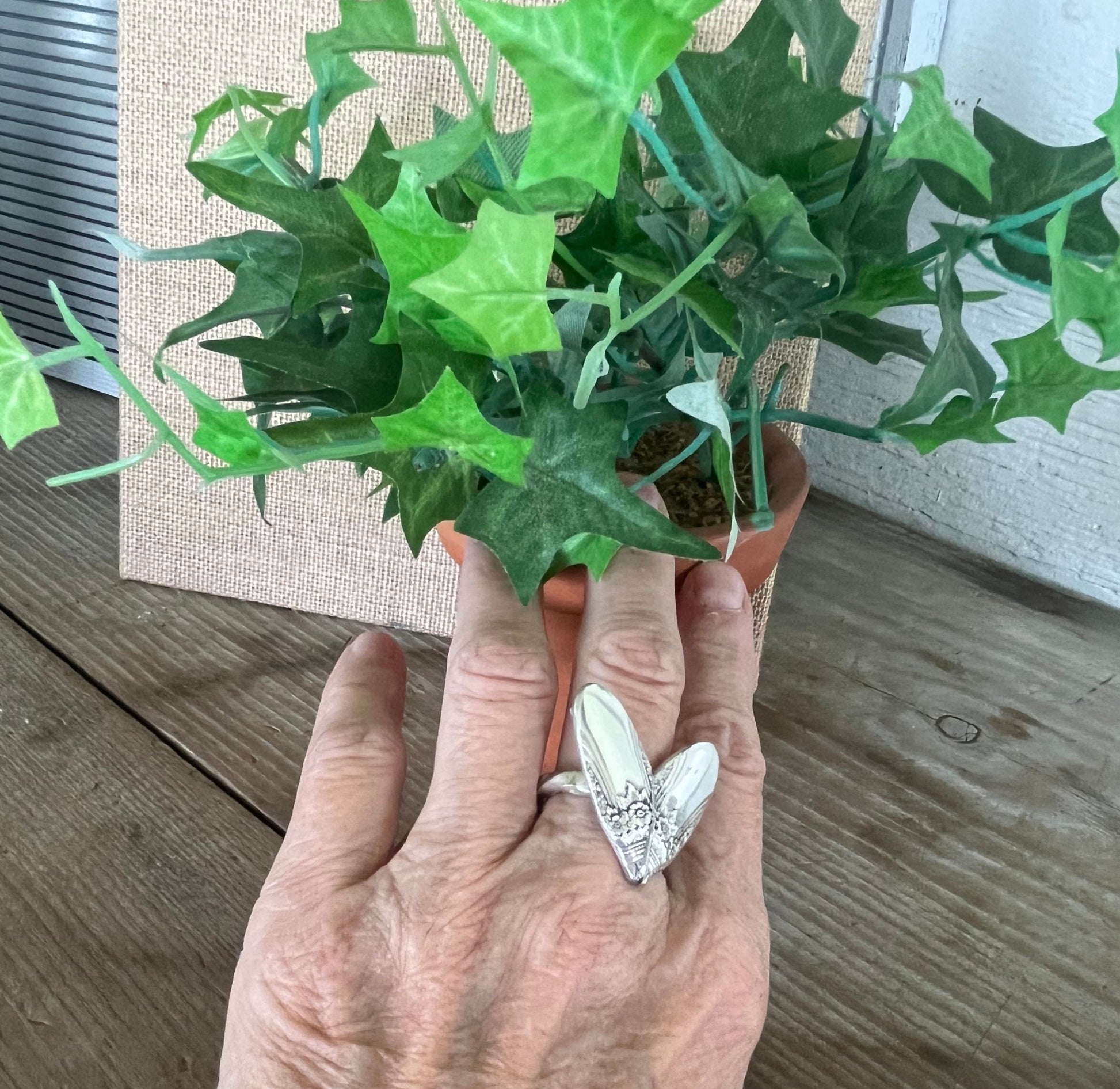 FIRST LOVE pattern sculpted heart statement ring on shown on finger for scale - handcrafted from upcycled vintage silverware - Laughing Frog Studio