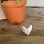 FIRST LOVE pattern sculpted heart statement ring on wood surface - Statement Ring - handcrafted from upcycled vintage silverware - Laughing Frog Studio