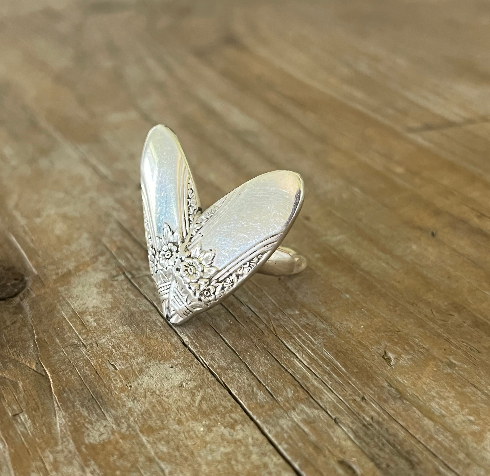 Detail view of FIRST LOVE pattern sculpted heart statement ring - statement spoon ring - handcrafted from upcycled vintage silverware - Laughing Frog Studio