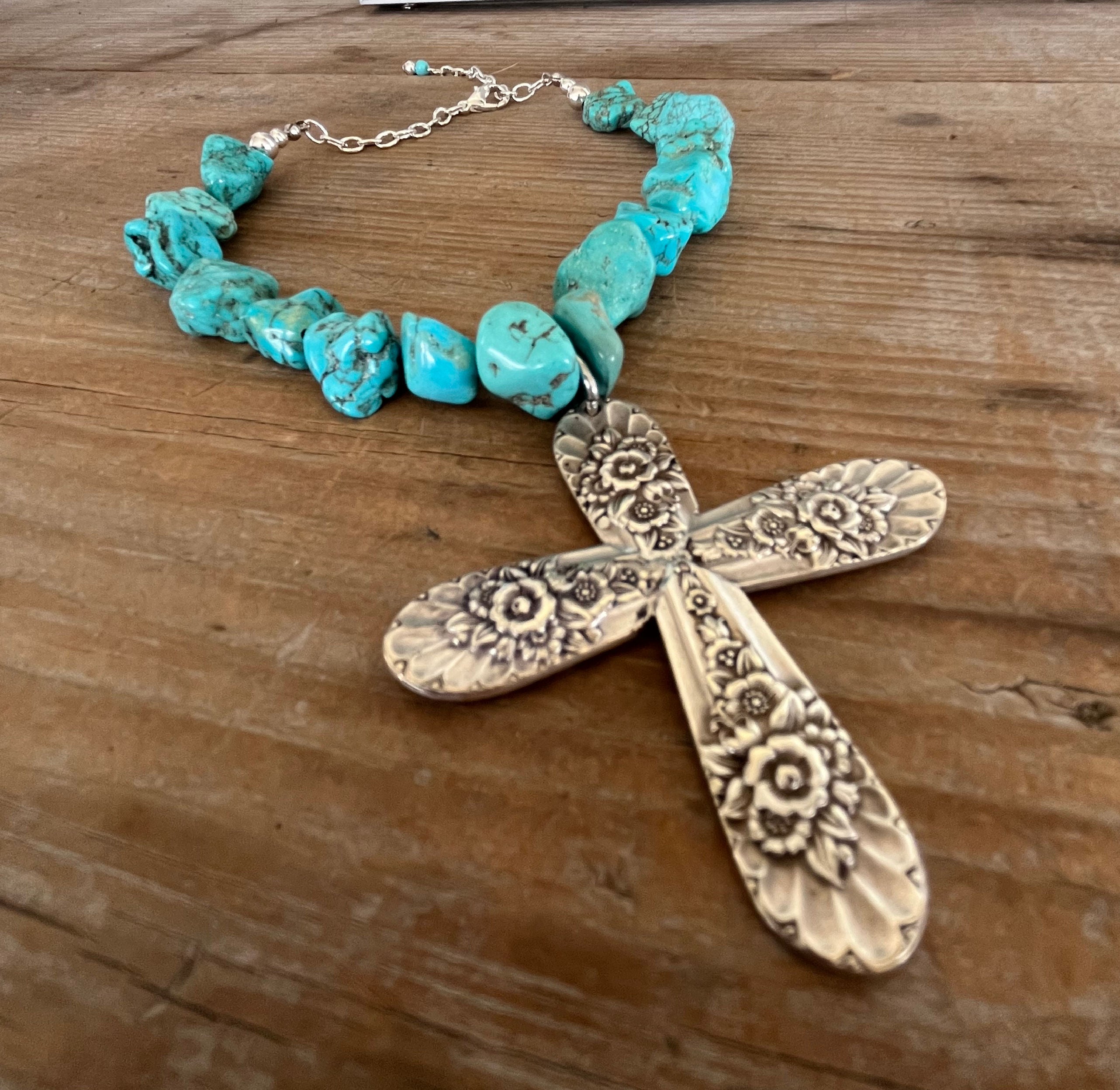 Close up of Jubliee by International Silver chunky turquoise howlite bead choker with spoon cross pendant and silverplate accents - handcrafted from upcycled vintage silverware - Laughing Frog Studio