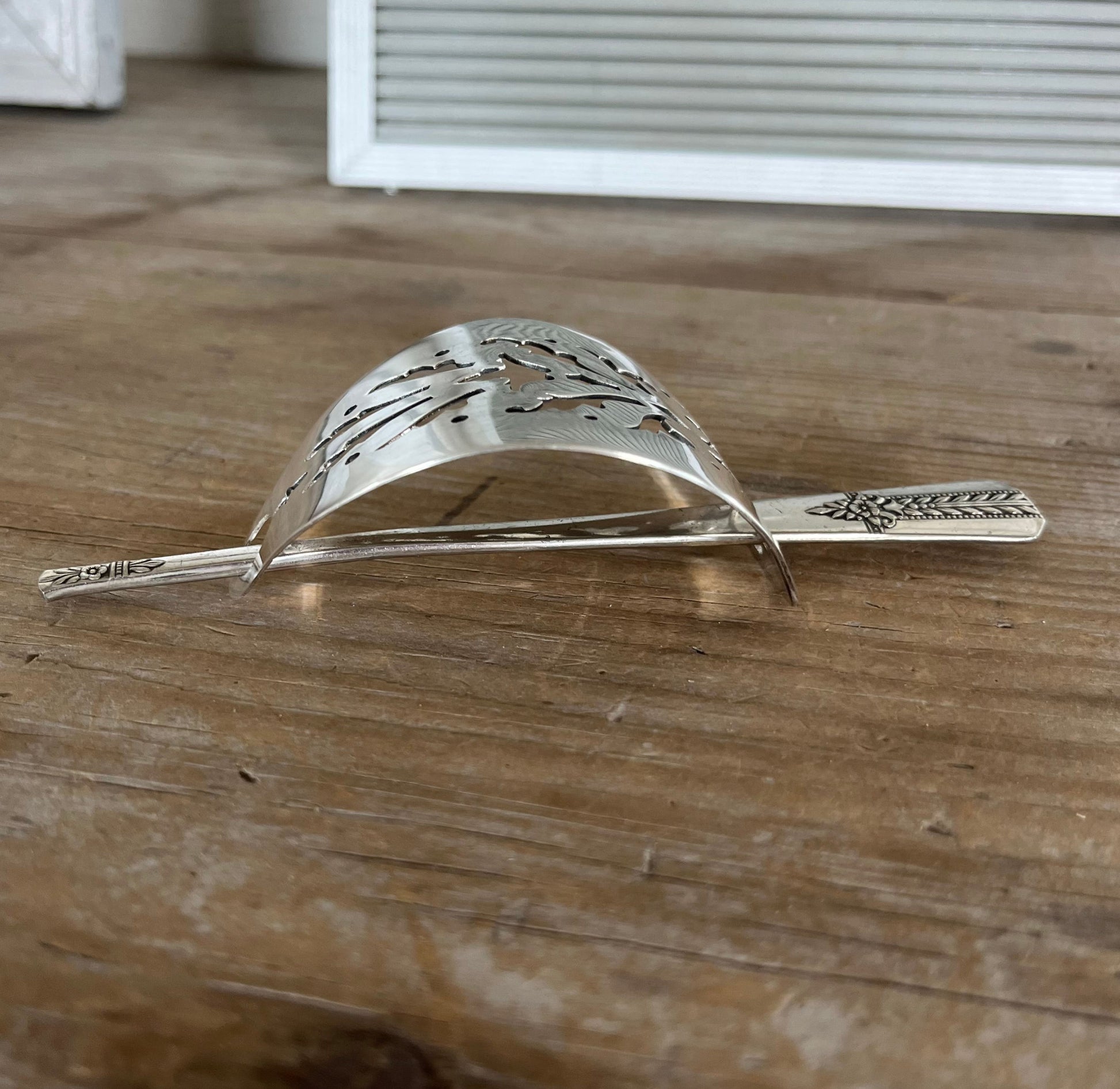 Side view of cake server hair barrette with iced tea spoon stick - handcrafted upcycled vintage silverware hair accessory - Laughing Frog Studio