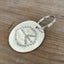 Peace sign hand-stamped spoon keychain - handcrafted from upcycled vintage silverware - Laughing Frog Studio