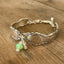 Close-up of Oneida Dover pattern spoon link bracelet with glass beads - handcrafted from upcycled vintage silverware - Laughing Frog Studio