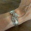 Holmes & Edwards Imperial pattern spoon link bracelet with Czech glass beads shown on a wrist - handcrafted from upcycled vintage silverware - Laughing Frog Studio