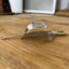 Side view of Senate Silverplate Jean cake server hair barrette worn in hair with stick - handcrafted from upcycled vintage silverware - Laughing Frog Studio