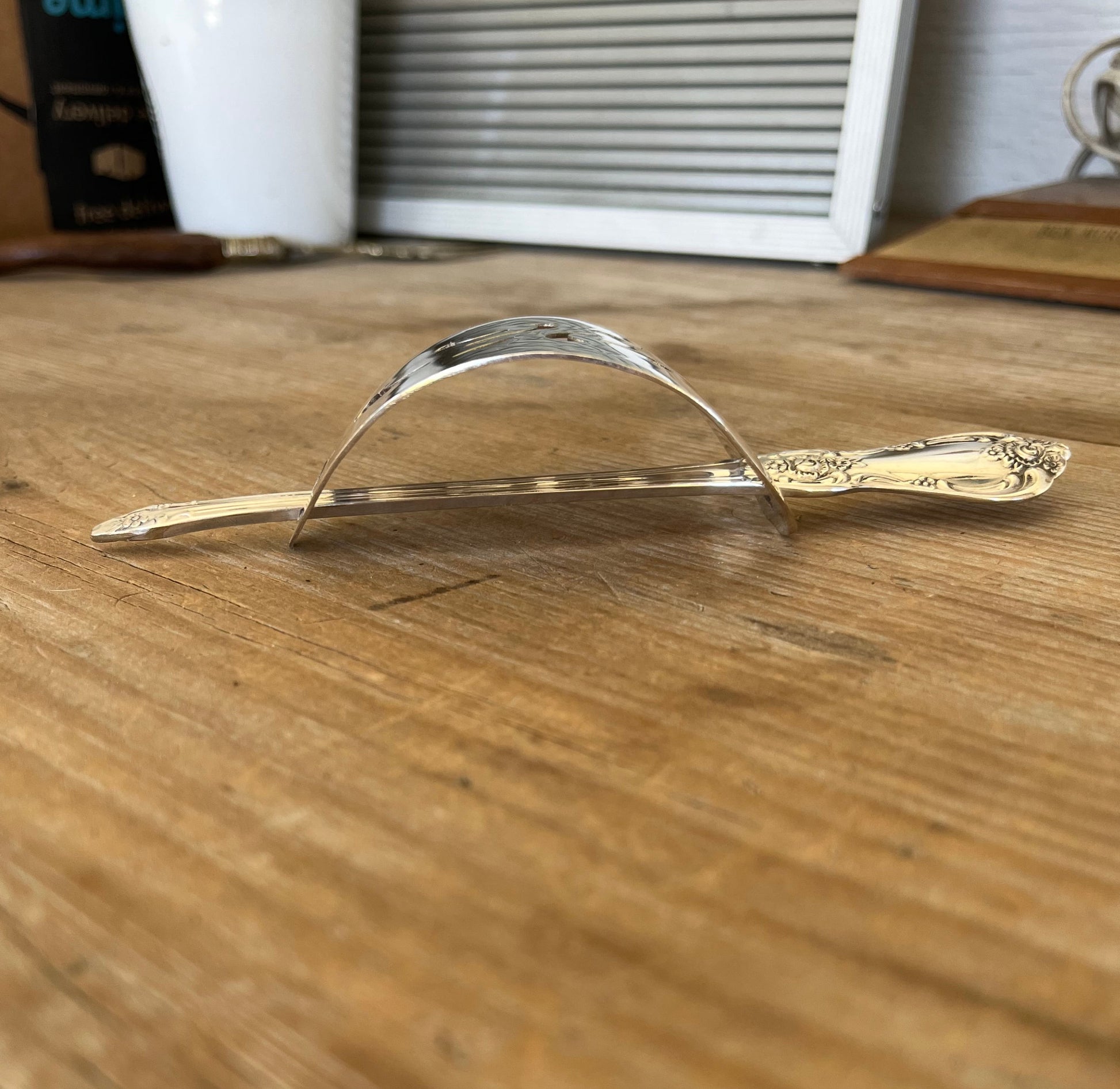 Side view of Oneida Vanessa/Francesca cake server hair barrette with stick - handcrafted from upcycled vintage silverware - Laughing Frog Studio