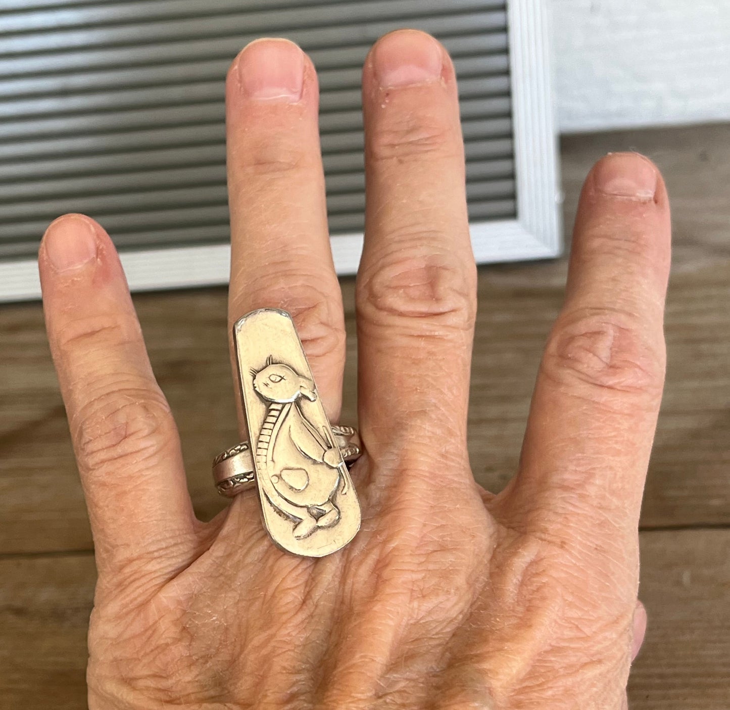 Peter Rabbit spoon ring shown on hand - whimsical handcrafted upcycled silverware jewelry - Laughing Frog Studio