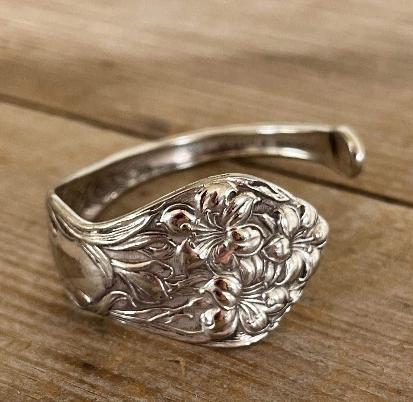 Close up of Stratford Silverplate Lilyta pattern spoon cuff bracelet - upcycled vintage silverware - Laughing Frog Studio