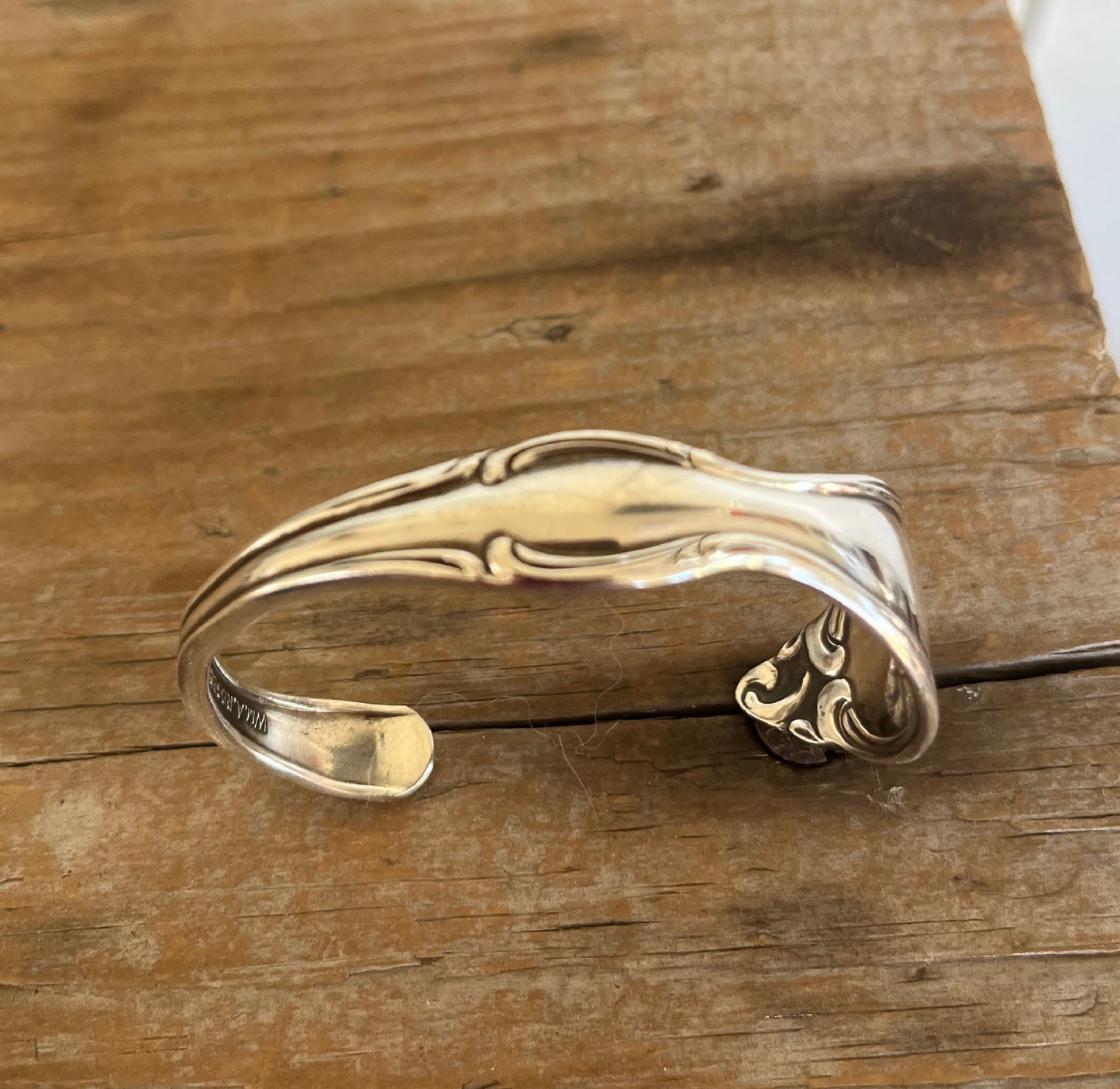 Top view of Old South spoon cuff bracelet - vintage 1949 Oneida silverplate with decorative border - upcycled vintage silverware - Laughing Frog Studio