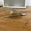 Profile view of handmade cake server barrette showing curved vintage silverplate shape