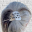Handcrafted cake server barrette adorning bun hairstyle displaying punched silverware texture in hair upcycled vintage silverware - Laughing Frog Studio