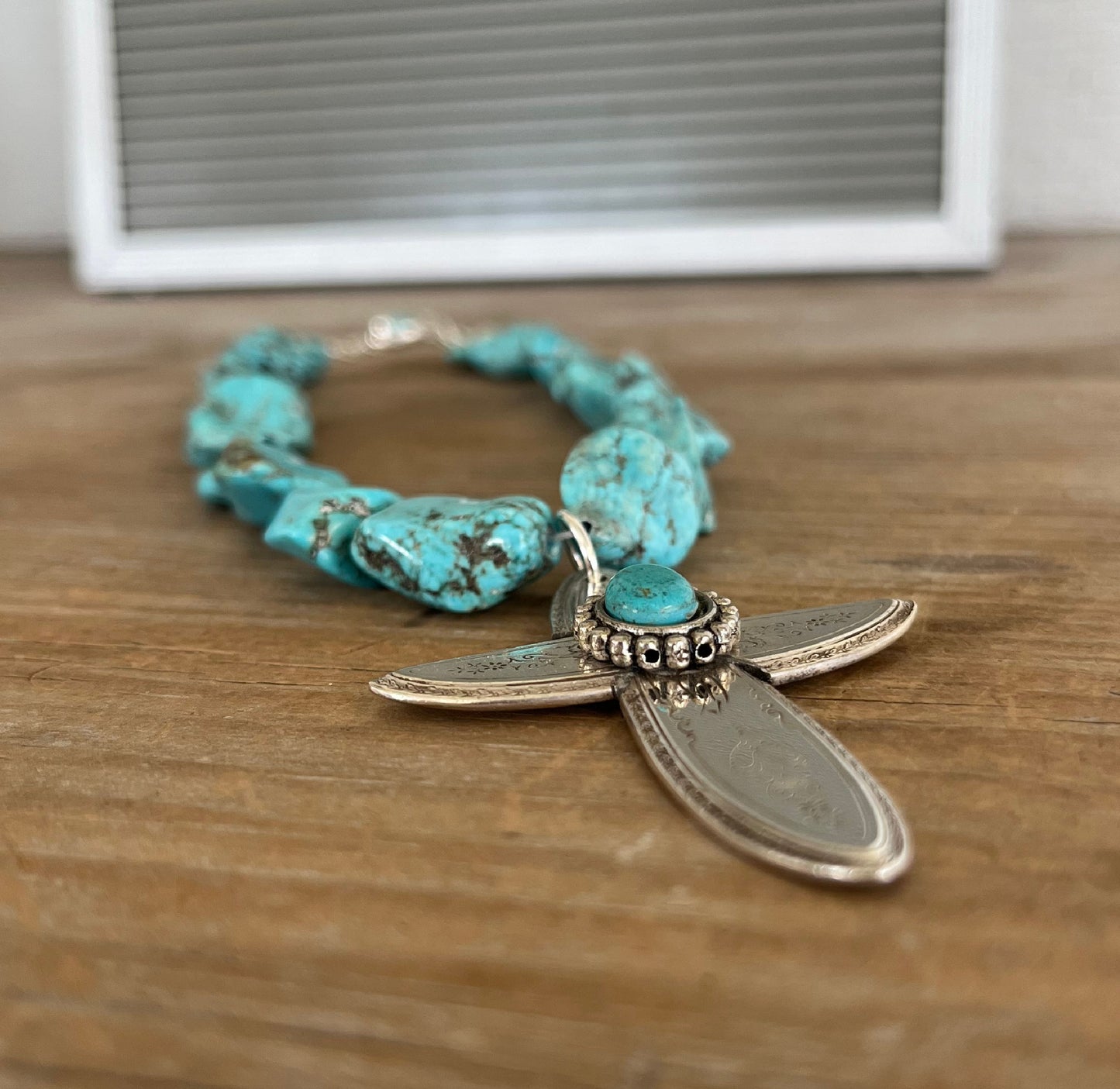 Close-up of Handcrafted spoon cross pendant on chunky turquoise howlite choker necklace - upcycled from vintage Argosy silverware - Laughing Frog Studio