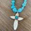 Closeup of Handcrafted spoon cross pendant on chunky turquoise howlite choker necklace - upcycled from vintage Argosy silverware - Laughing Frog Studio