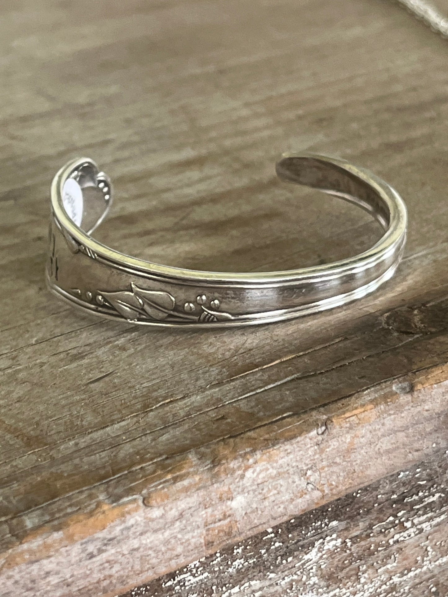 Top view of FUCKITY FUCK FUCK hand-stamped spoon cuff bracelet - Stamped Spoon Bracelet - handcrafted from upcycled vintage silverware - Laughing Frog Studio
