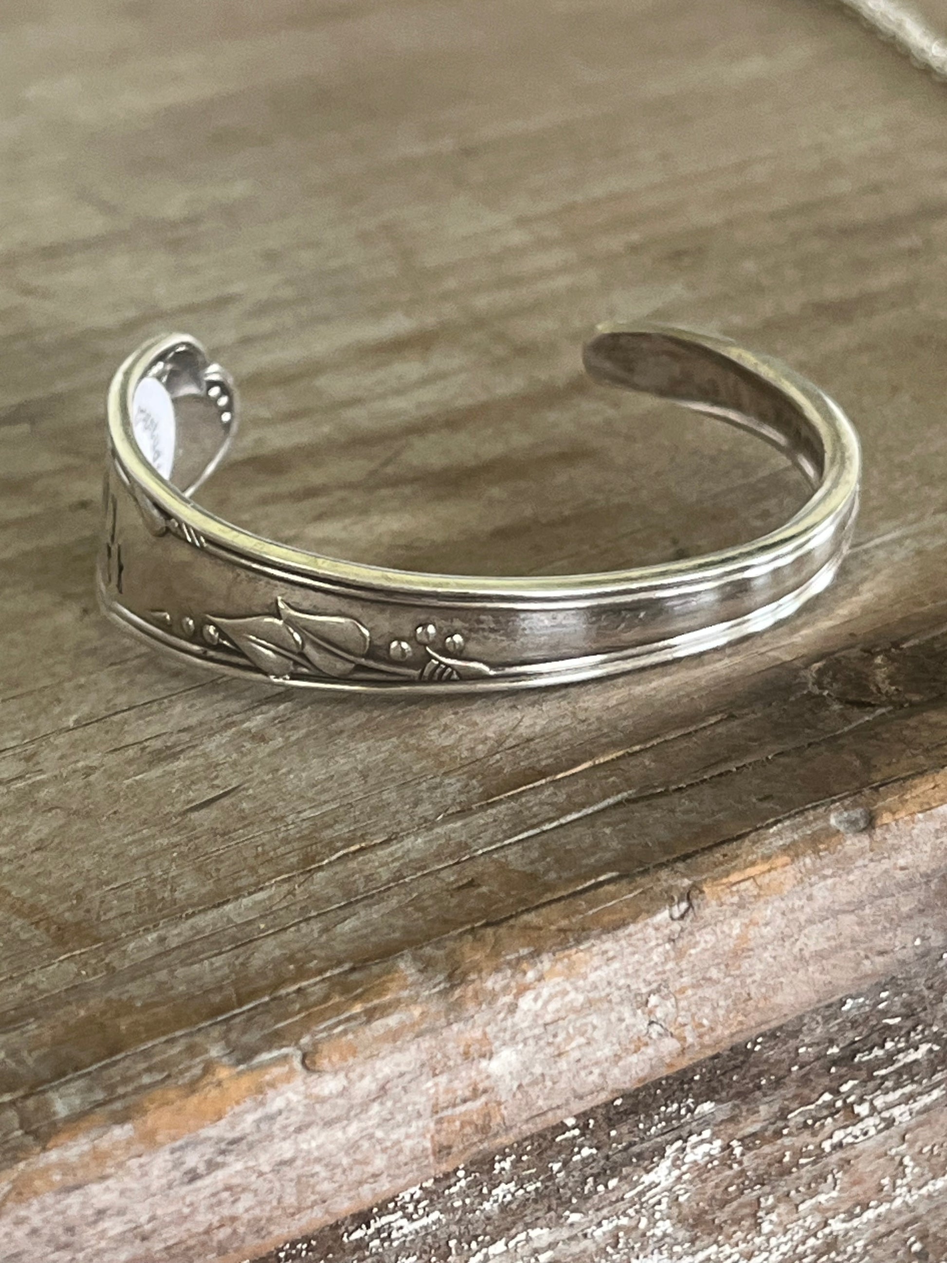 Top view of FUCKITY FUCK FUCK hand-stamped spoon cuff bracelet - Stamped Spoon Bracelet - handcrafted from upcycled vintage silverware - Laughing Frog Studio