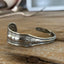 Upcycled spoon cuff bracelet with Edwardian floral border detail - handcrafted from upcycled vintage silverware - Laughing Frog Studio
