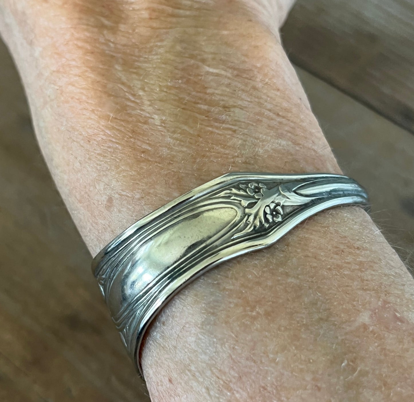 Vintage silverplate spoon cuff bracelet shown on wrist - handcrafted from upcycled vintage silverware - Laughing Frog Studio
