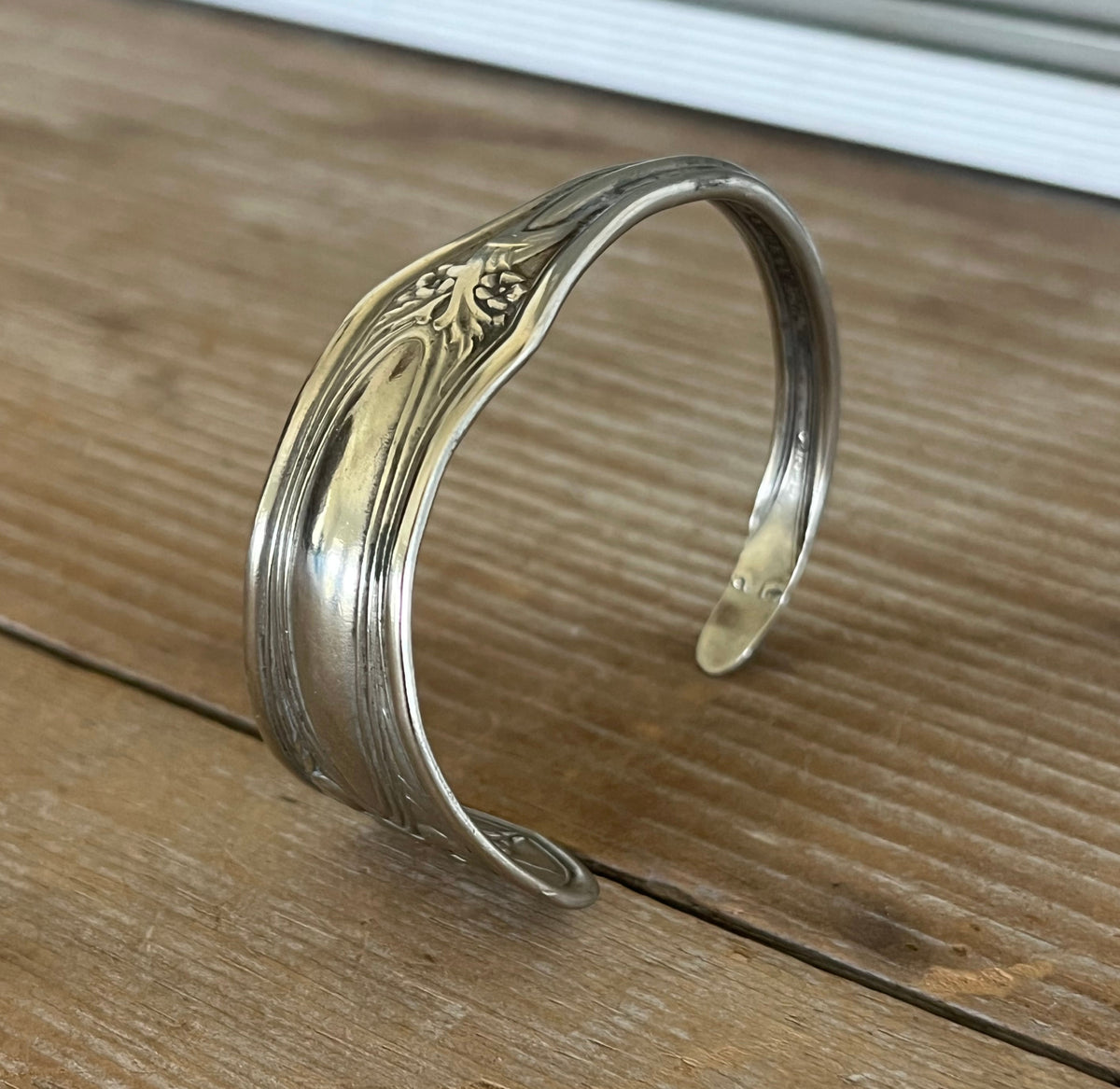 Upcycled 1910 silverplate spoon cuff curved view - handcrafted from upcycled vintage silverware - Laughing Frog Studio