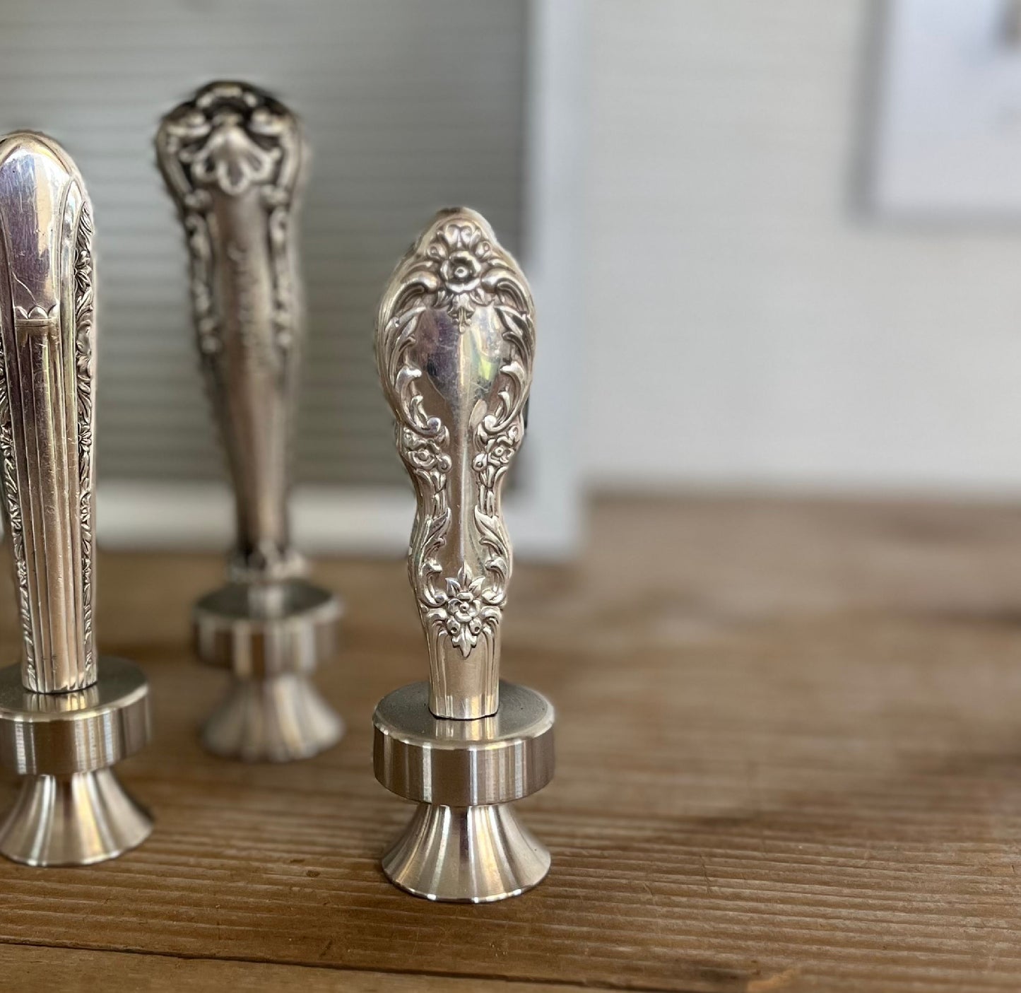Close up of William Rogers Grand Elegance pattern knife bottle opener with ornate floral handle - handcrafted upcycled vintage silverware accessory - Laughing Frog Studio