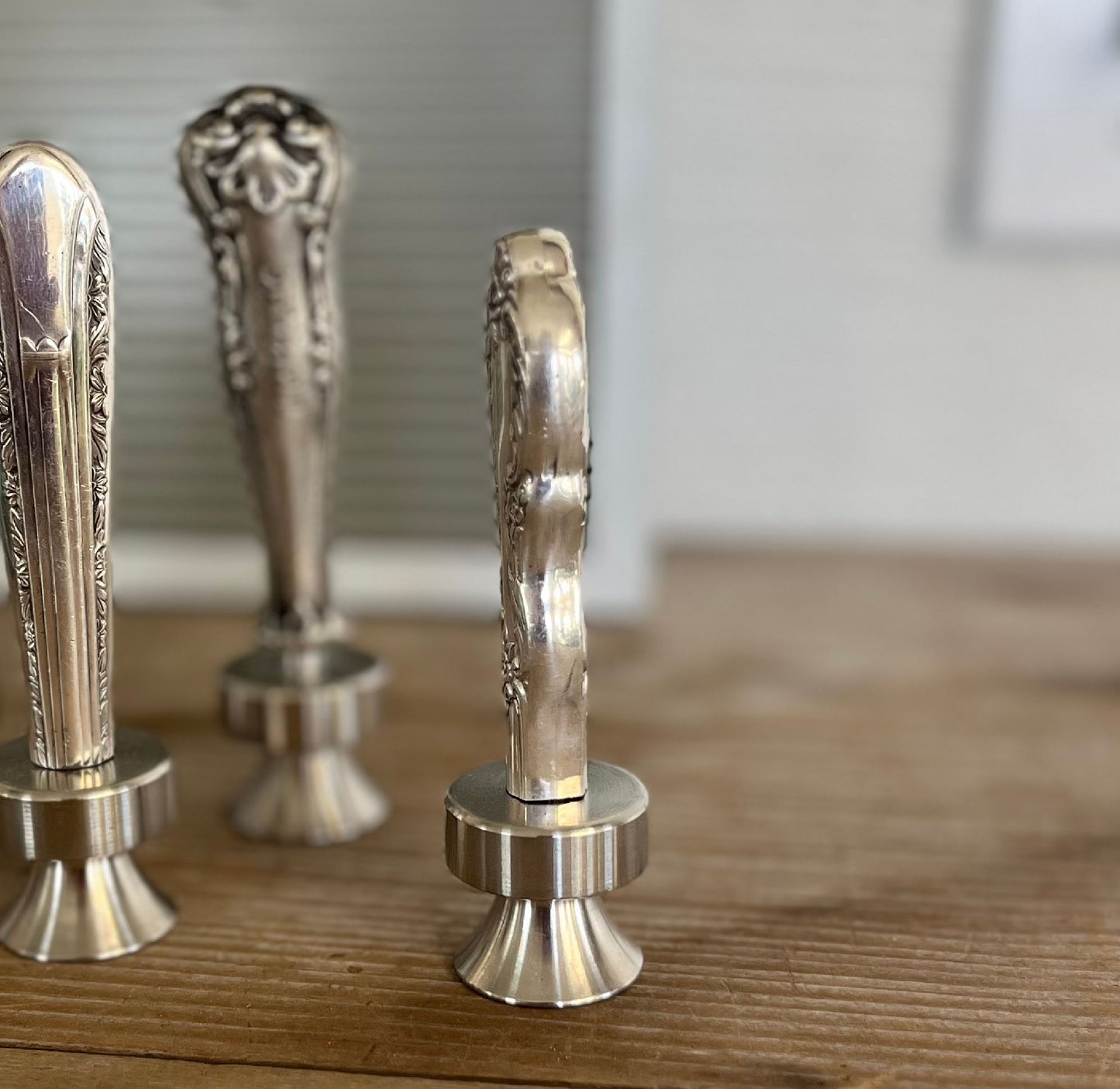 Side view detail of William Rogers Grand Elegance pattern knife bottle opener with ornate floral handle - handcrafted upcycled vintage silverware accessory - Laughing Frog Studio