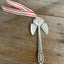 Josephine pattern artisan angel ornament with spoon handle body and spoon bowl wings with red striped ribbon hanger - handcrafted upcycled vintage silverware ornament - Laughing Frog Studio