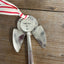Close-up detail of hand-stamped face of Josephine pattern artisan angel ornament with spoon handle body and spoon bowl wings - handcrafted upcycled vintage silverware ornament - Laughing Frog Studio