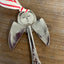Close-up stamping detail of Pearl artisan angel ornament with spoon handle body and spoon bowl wings with red striped ribbon hanger - handcrafted upcycled vintage silverware ornament - Laughing Frog Studio