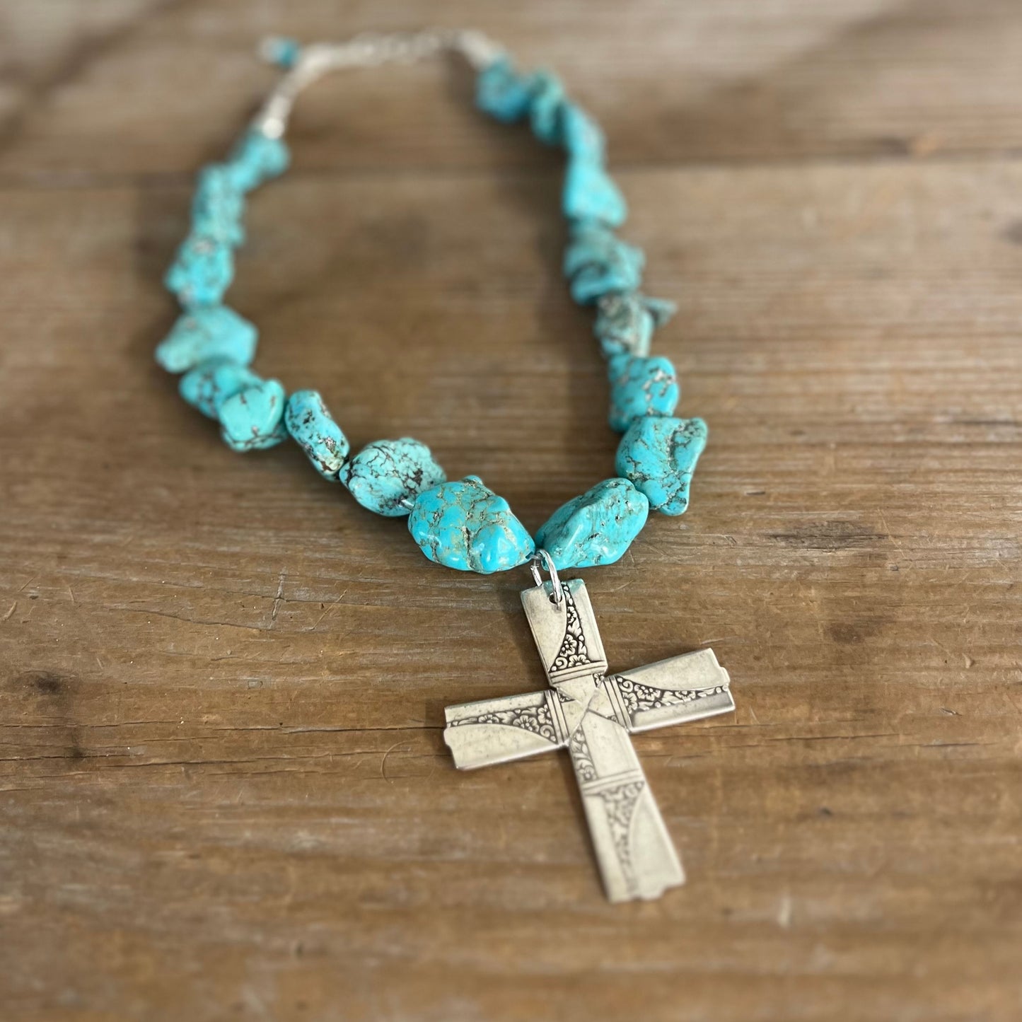 Nobility Plate Caprice pattern spoon cross pendant on chunky turquoise howlite choker shown on display bust - handcrafted upcycled vintage silverware jewelry - Laughing Frog Studio pattern