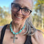 Jennifer Edmondson, owner, wearing Nobility Plate Caprice pattern spoon cross pendant on chunky turquoise howlite choker - handcrafted upcycled vintage silverware jewelry - Laughing Frog Studio