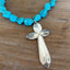 Close-up of cross pendant made from four vintage Exquisite spoon handles - upcycled silverplate Southwestern statement piece