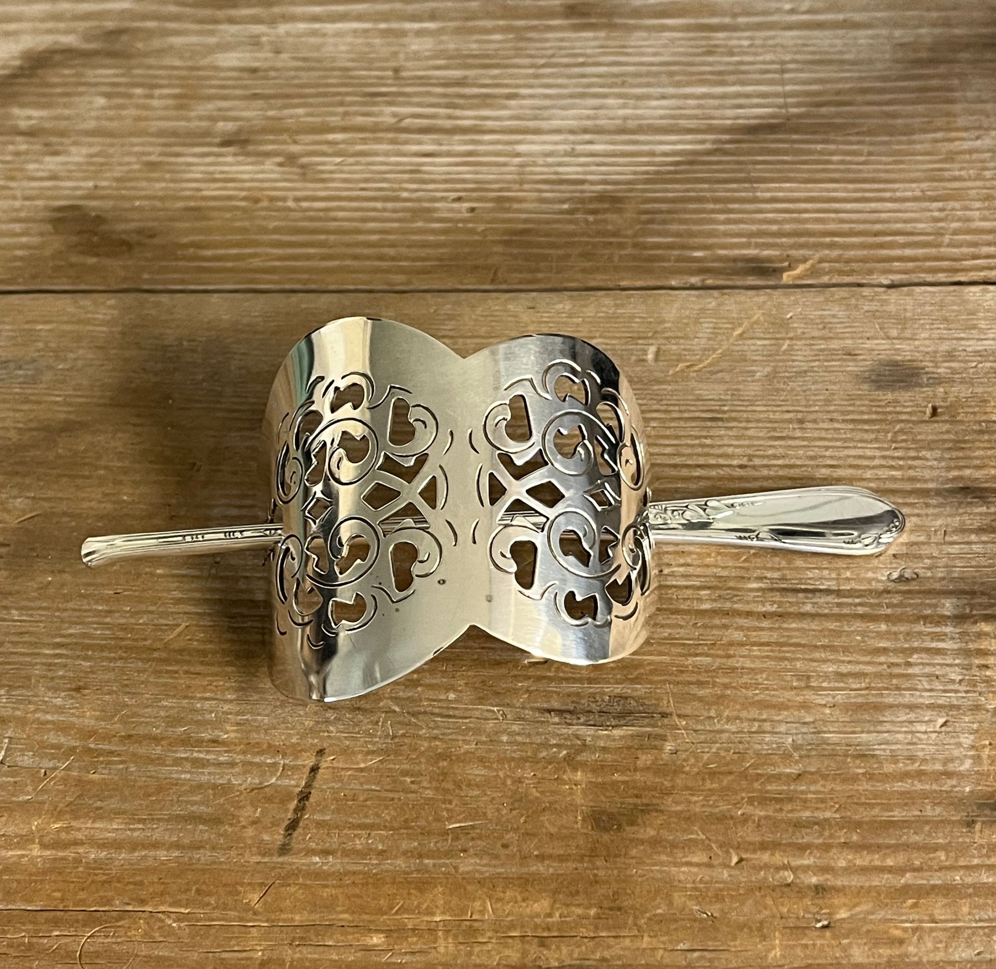 Danish cake server hair barrette with filigree floral cutout and meadow flower stick pin on weathered wood - handcrafted upcycled vintage silverware hair accessory - Laughing Frog Studio

