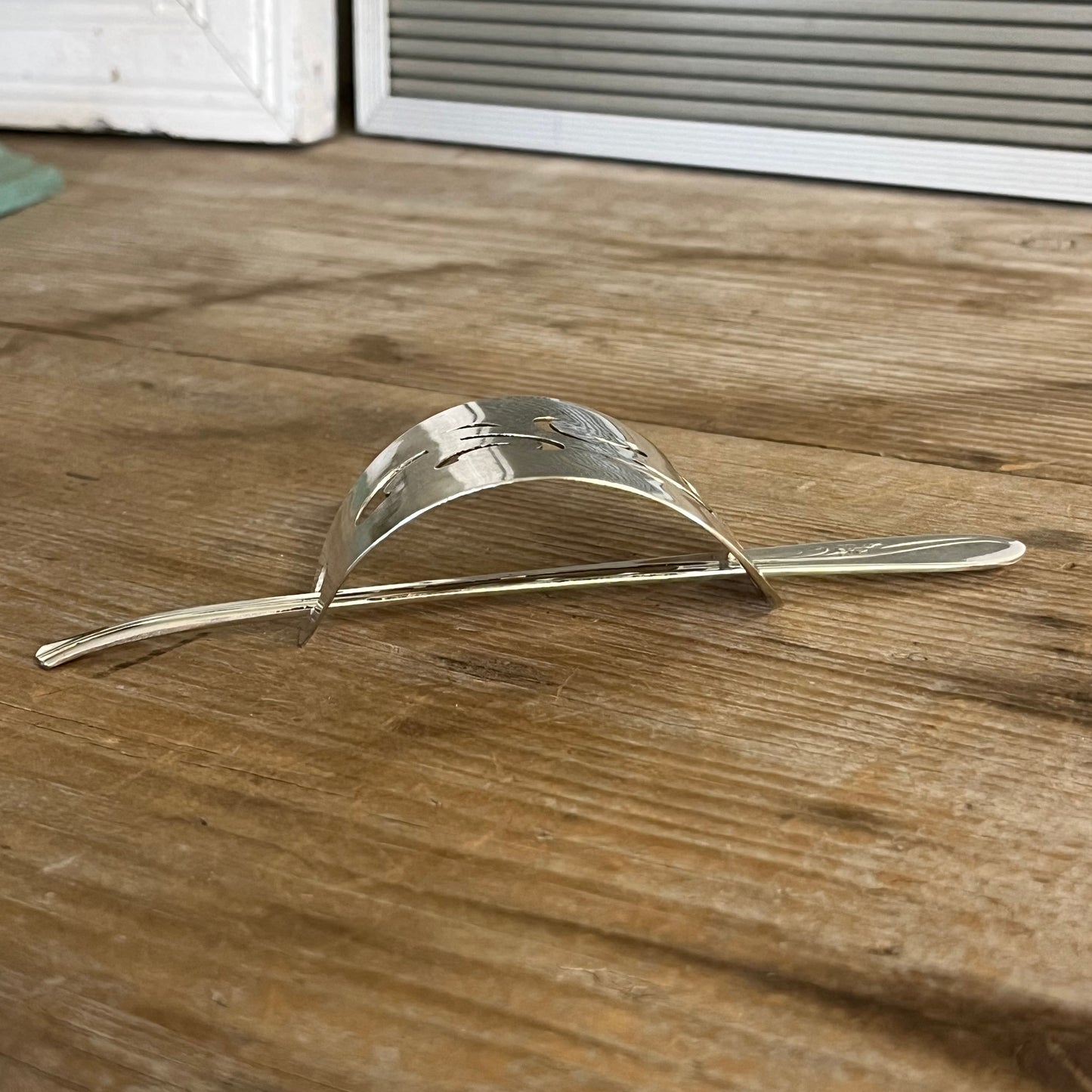 Side view cake server hair barrette with cut-out scroll design with Oneida Meadowbrook stick - handcrafted upcycled vintage silverware hair accessory - Laughing Frog Studio