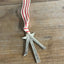 Back view of Scrap silverware Christmas tree shaped ornament with a star and red striped ribbon hanger - handcrafted upcycled vintage silverware ornament - Laughing Frog Studio