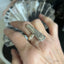 Artisan spoon ring featuring Mountain Rose floral pattern from antique silverware, size 9 shown on a hand