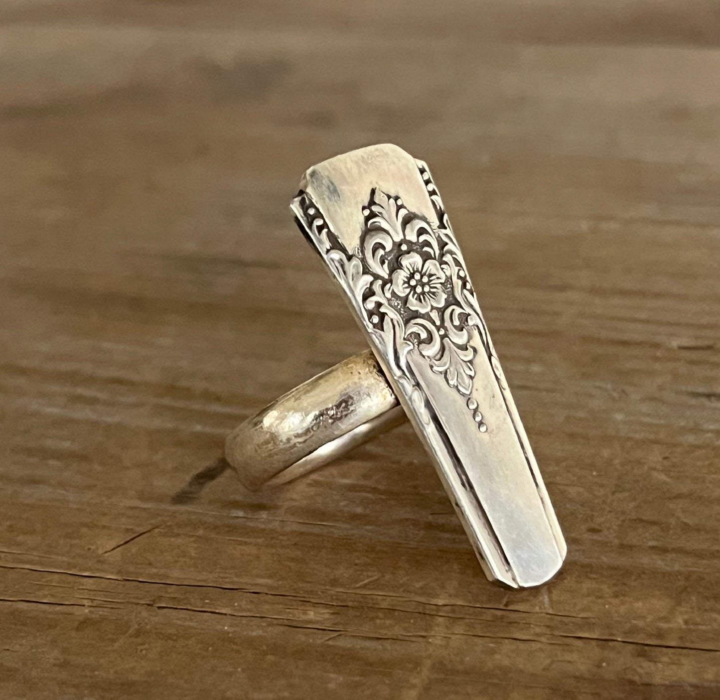 Close-up of Mountain Rose pattern detail on upcycled vintage silverware statement ring