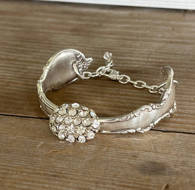 Front view of Reflection spoon link bracelet with rhinestone button center - handcrafted from upcycled vintage silverware - Laughing Frog Studio