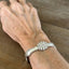 Silverware bracelet shown on a wrist for size - 1847 Rogers Brothers Reflection pattern spoon link bracelet - handcrafted from upcycled vintage silverware - Laughing Frog Studio