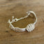 Flat lay of silverware bracelet - 1847 Rogers Brothers Reflection pattern spoon link bracelet - handcrafted from upcycled vintage silverware - Laughing Frog Studio