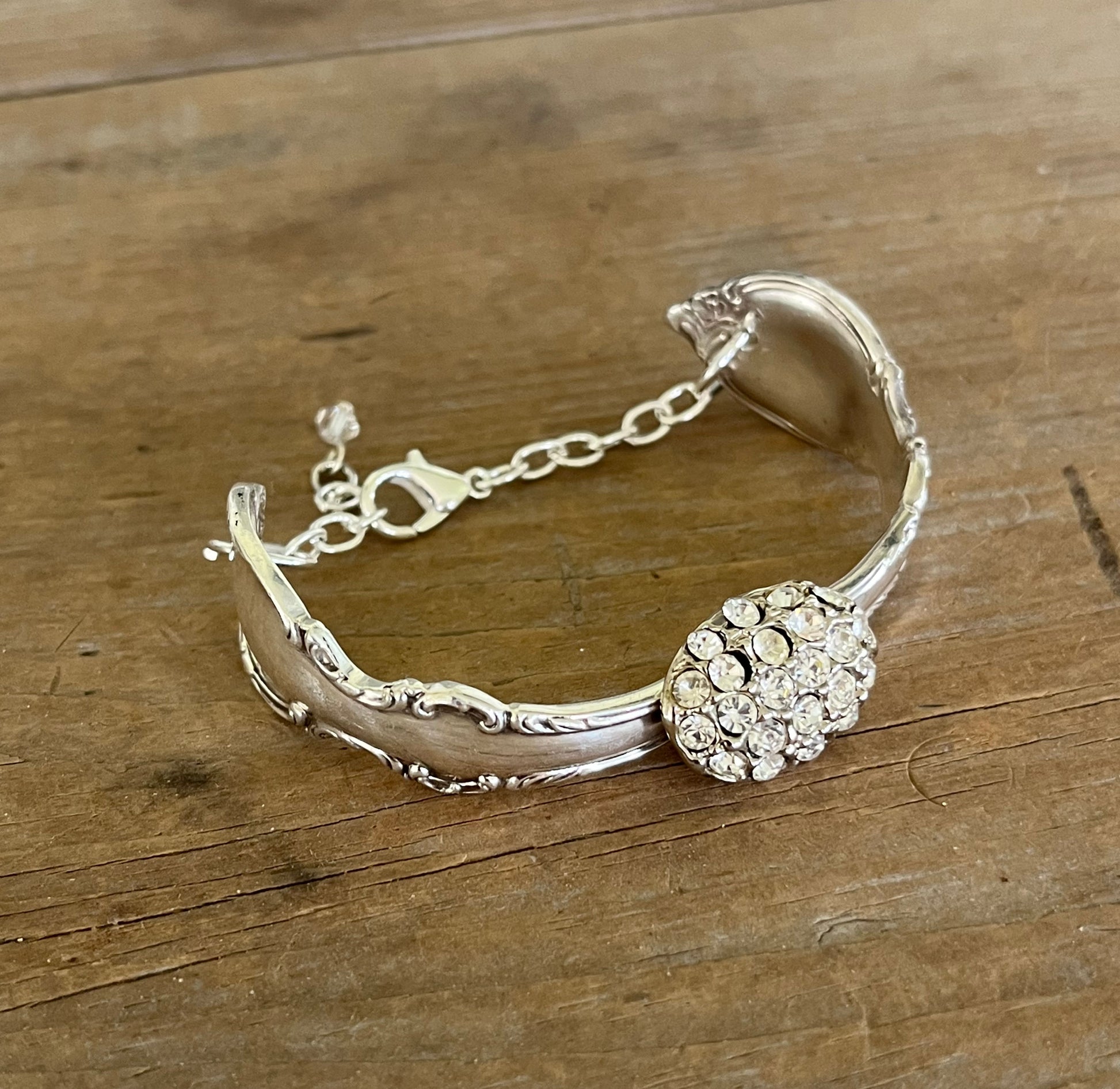 Flat lay of silverware bracelet - 1847 Rogers Brothers Reflection pattern spoon link bracelet - handcrafted from upcycled vintage silverware - Laughing Frog Studio