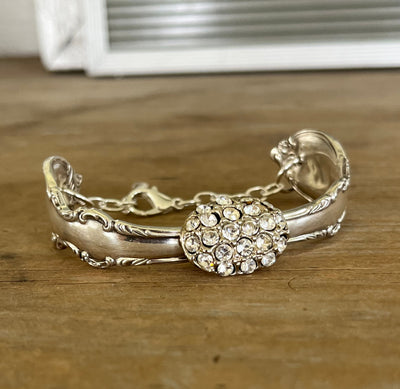 Close up view of vintage rhinestone button centerpiece on Reflection spoon link bracelet - handcrafted from upcycled vintage silverware - Laughing Frog Studio