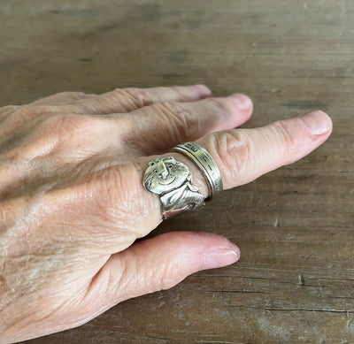 Tony the Tiger coil-wrap spoon ring showing on model - front face with mascot artwork - Spoon Ring - handcrafted from upcycled vintage silverware - Laughing Frog Studio