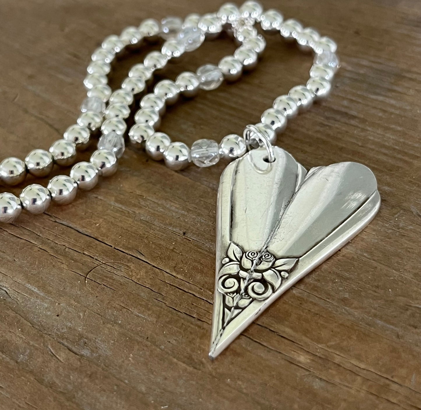 Vintage silverware heart pendant necklace detail - hand-forged from 1950s SL & GH Rogers Floral pattern - Laughing Frog Studio