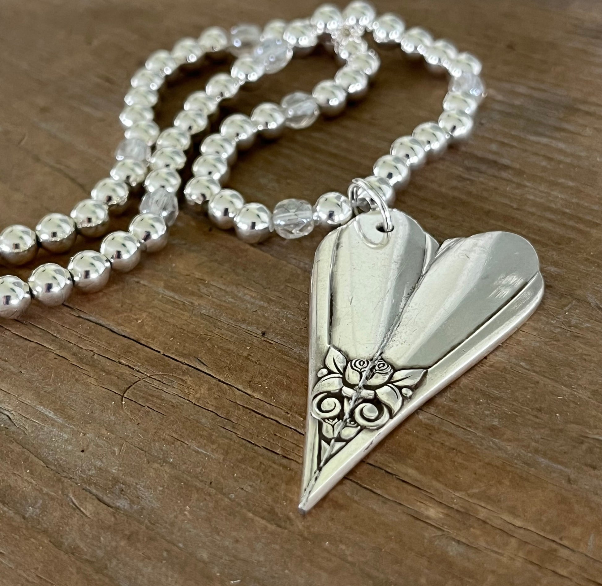 Vintage silverware heart pendant necklace detail - hand-forged from 1950s SL & GH Rogers Floral pattern - Laughing Frog Studio